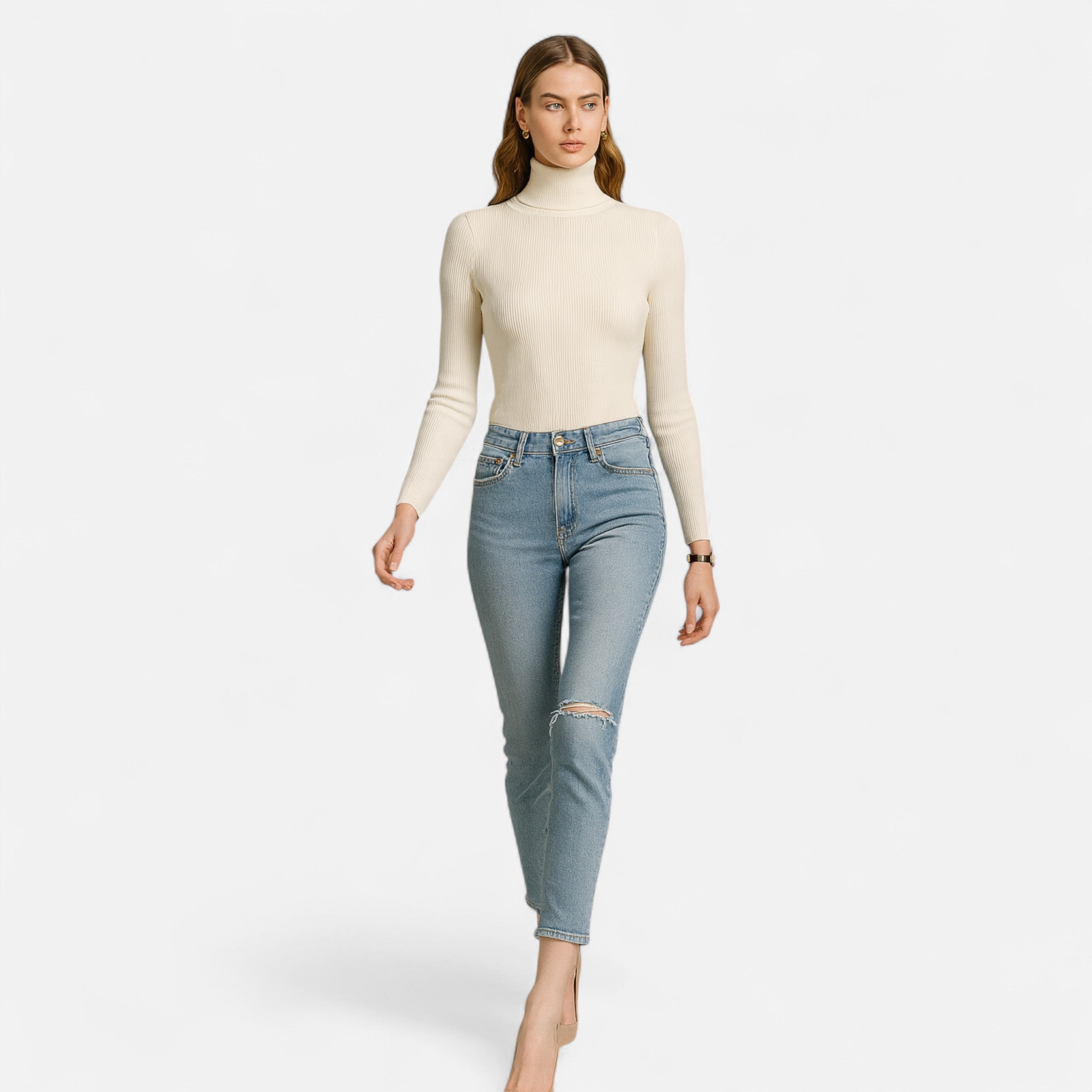 Woman wearing a cream turtleneck and light blue jeans on a white background