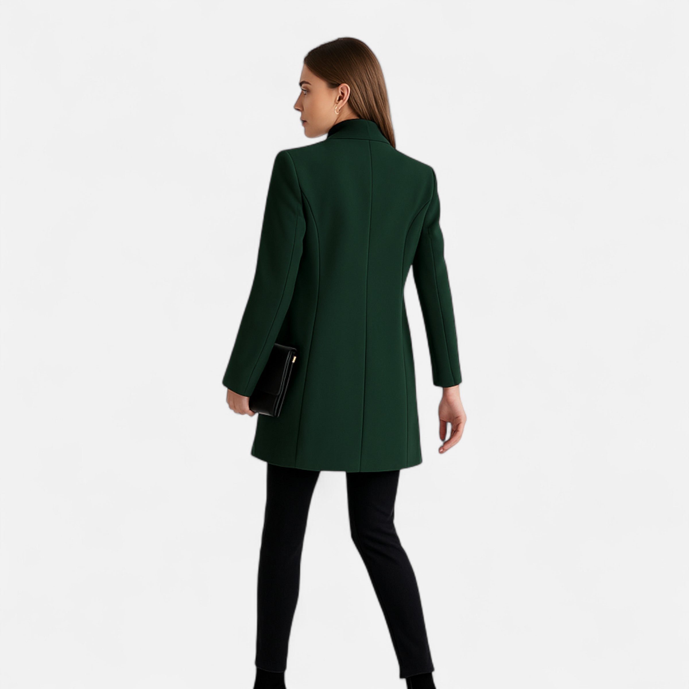 Woman wearing a green coat on a white background