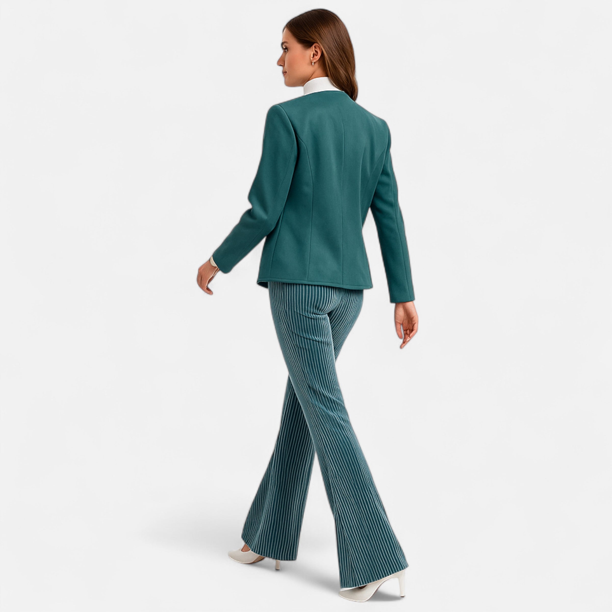 Woman wearing a teal suit on a white background