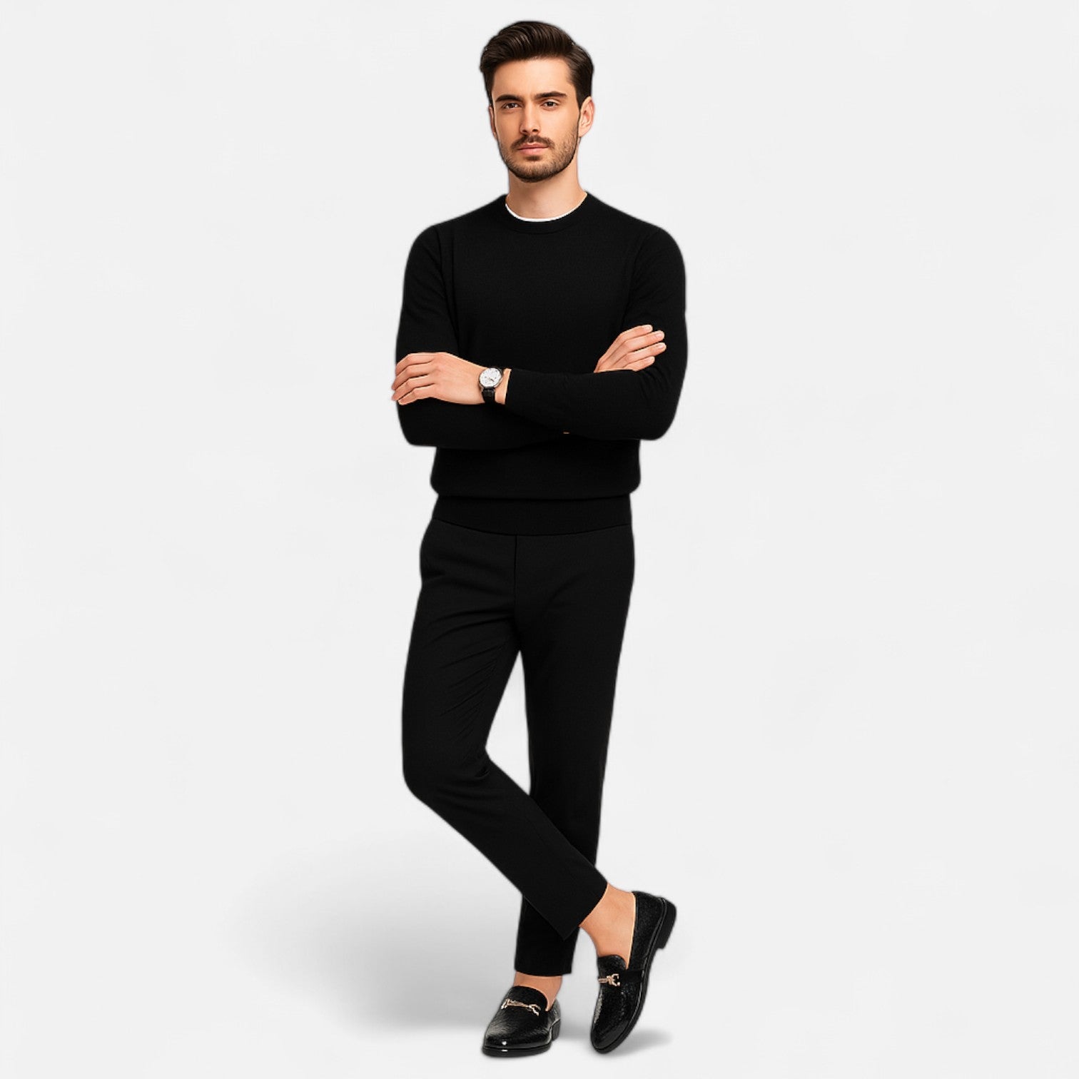 Man wearing a black outfit with a white background