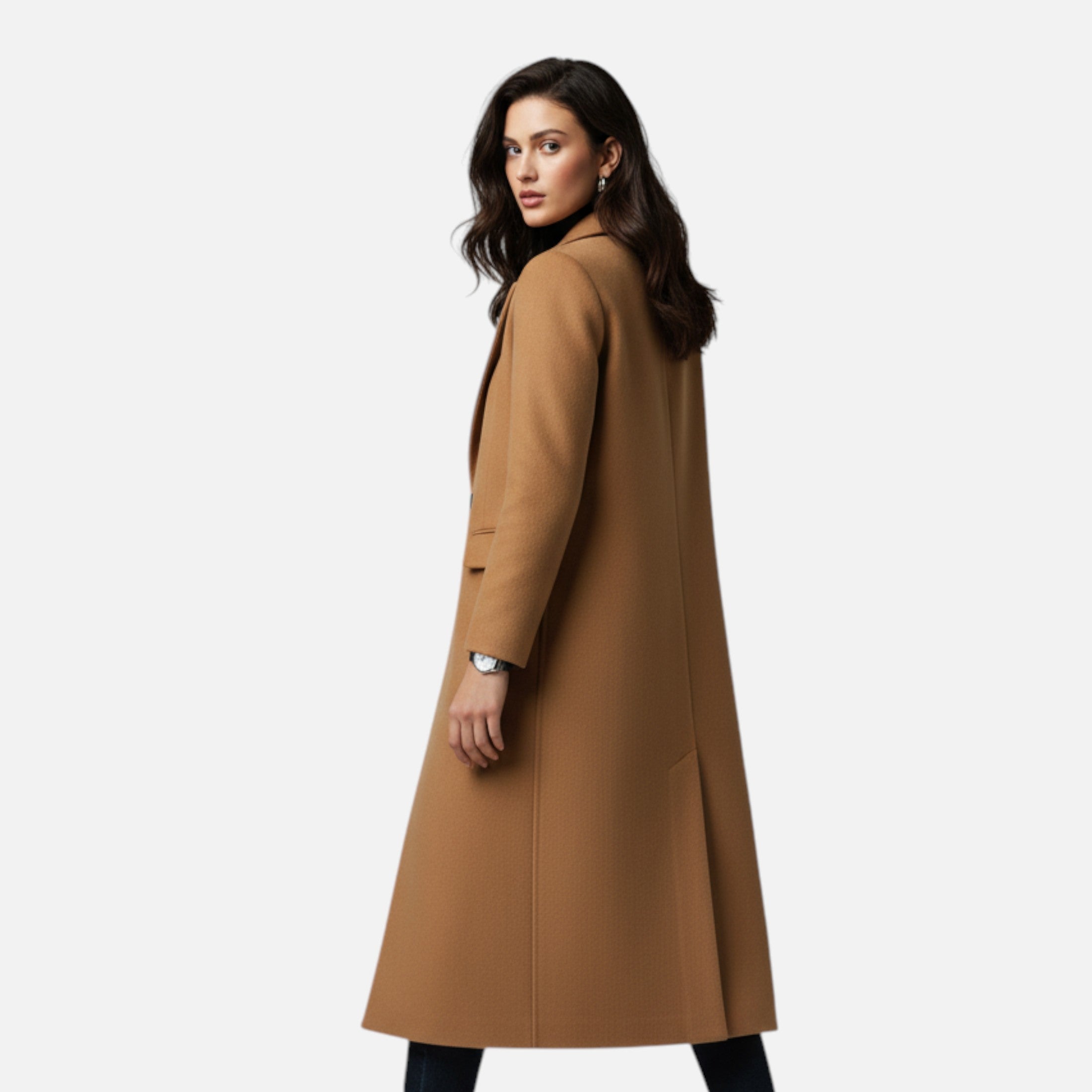 Woman wearing a long brown coat on a white background