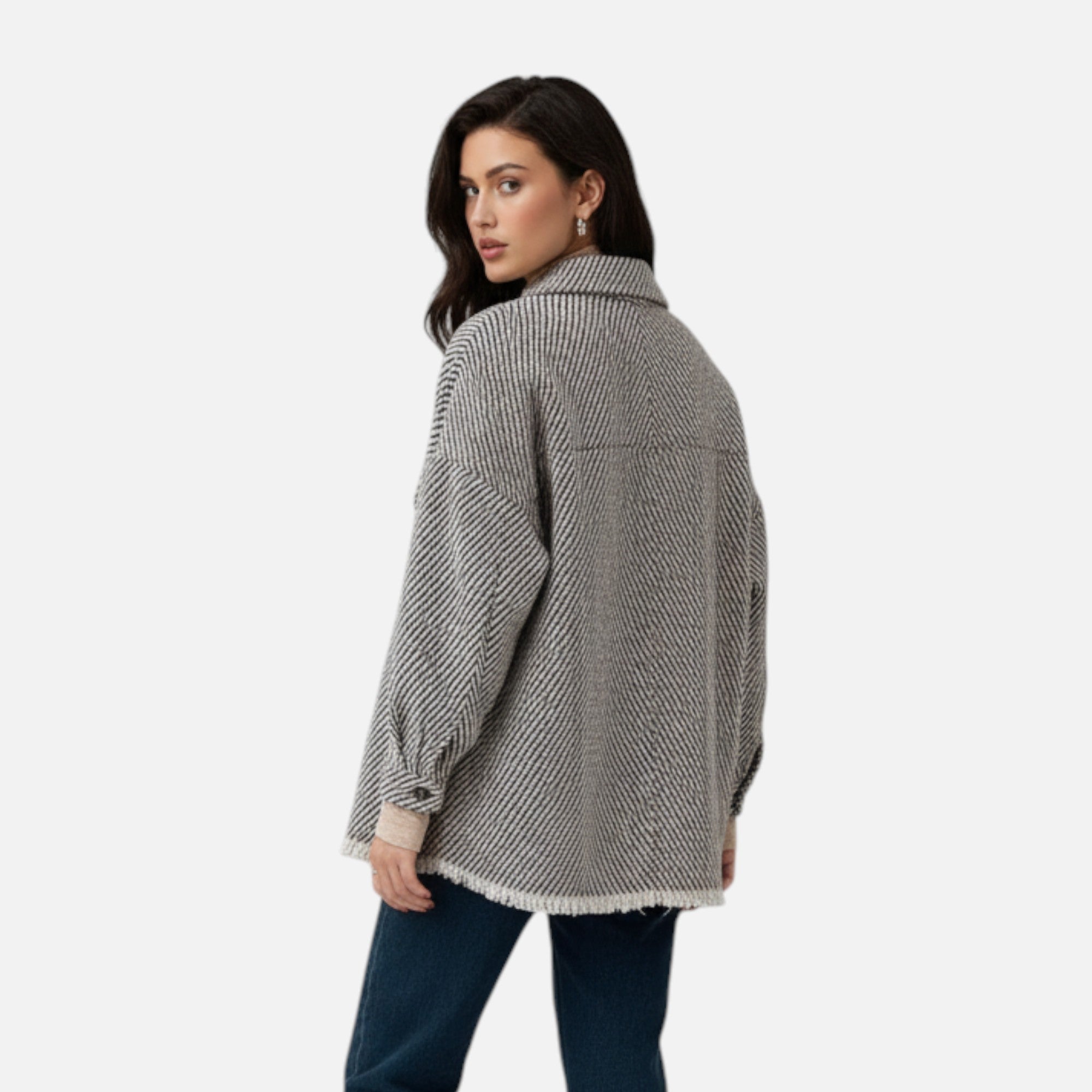 Woman wearing a gray textured jacket on a white background