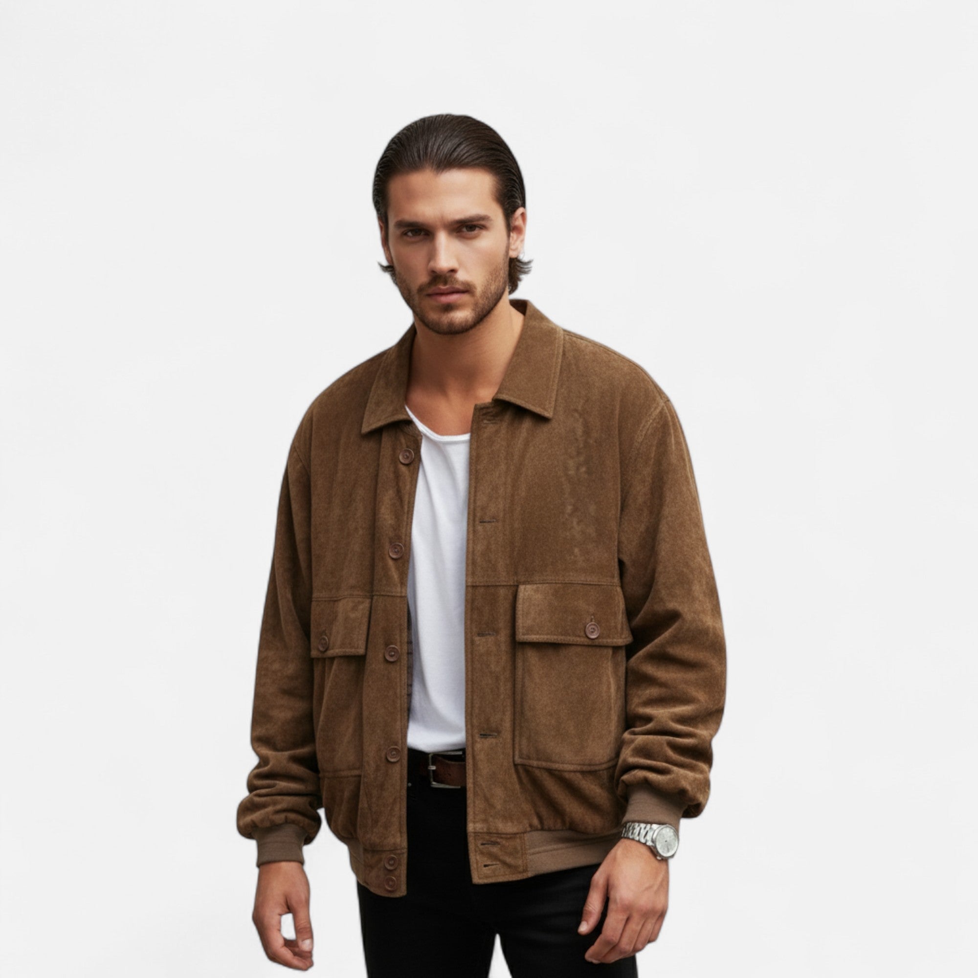 Man wearing a brown jacket over a white shirt on a light gray background