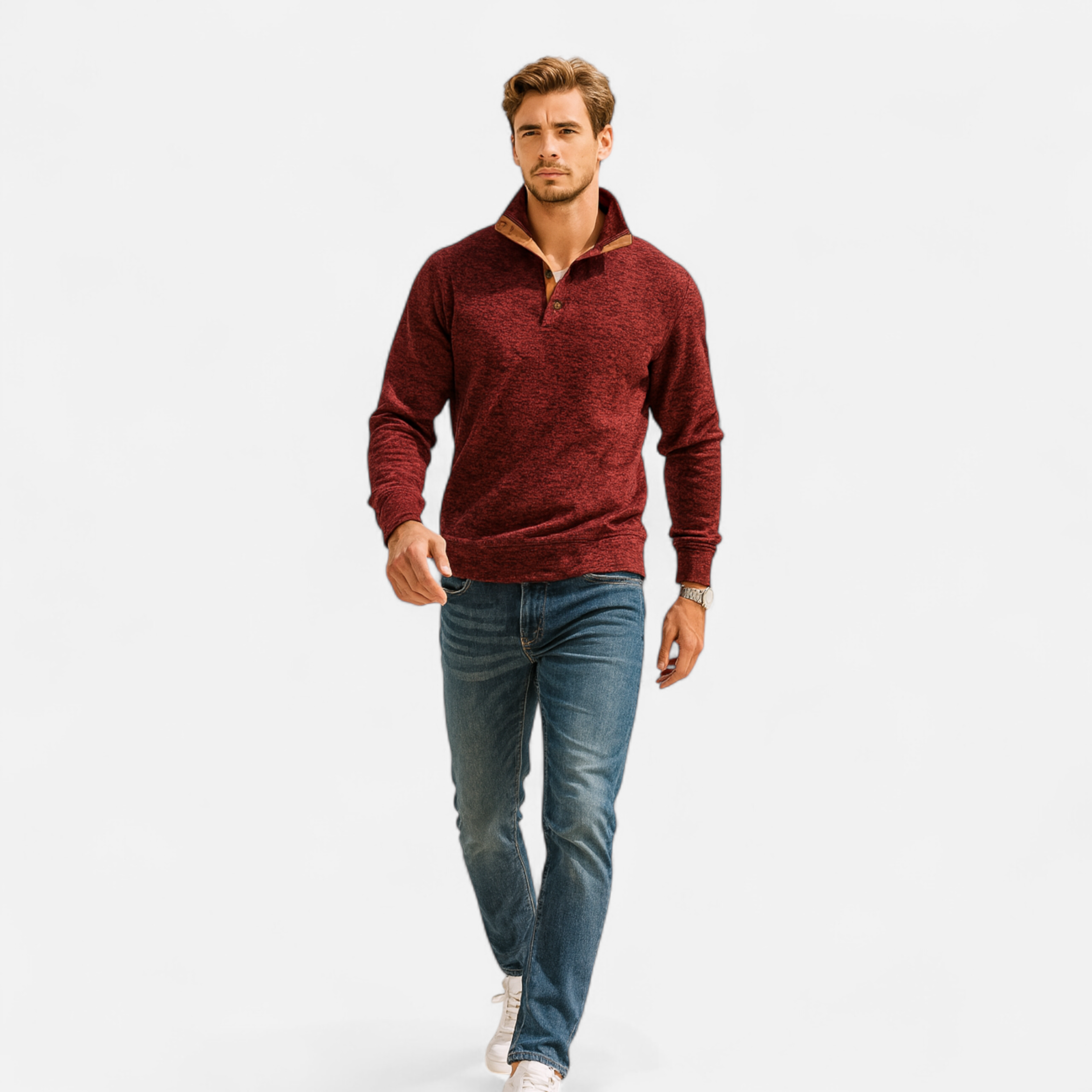 Man wearing a red sweater and blue jeans on a white background