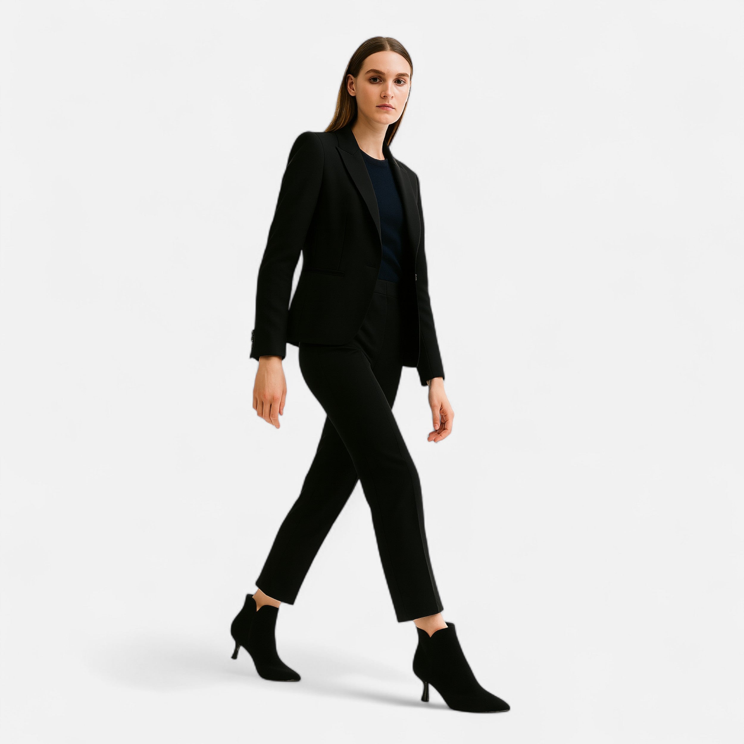 Woman wearing a black suit on a white background