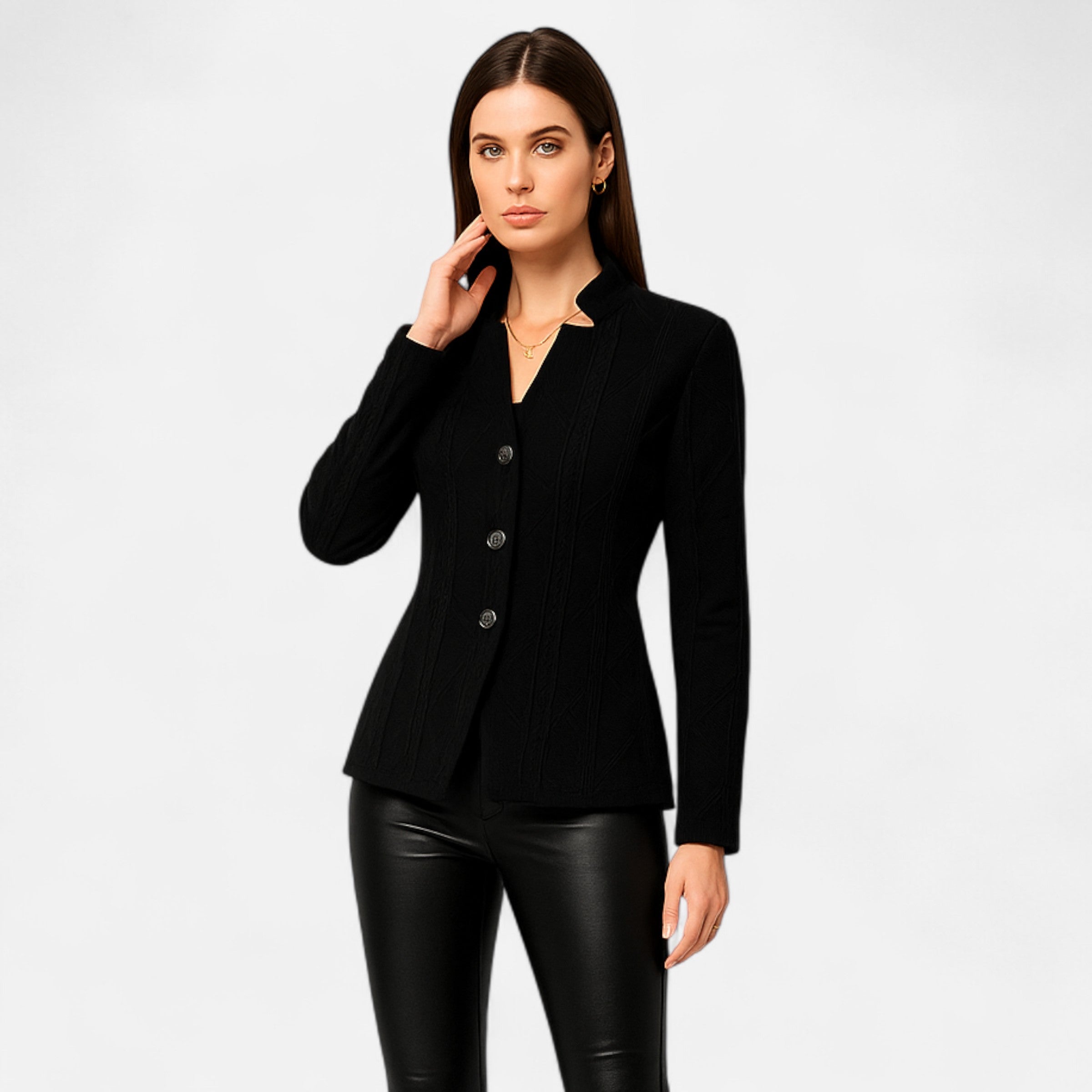 Woman wearing a black blazer and black pants on a white background