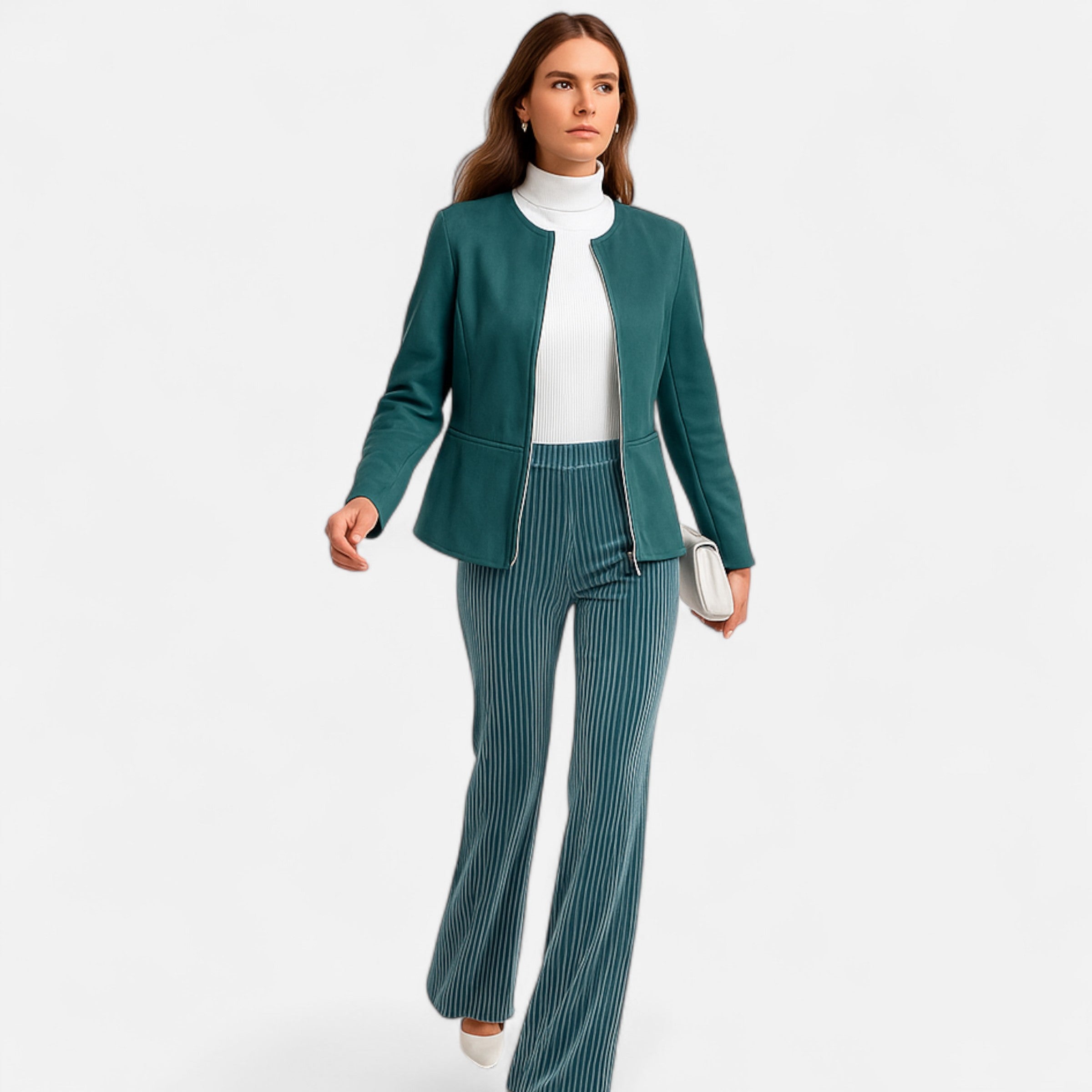 Woman wearing a teal suit with a white top on a light gray background