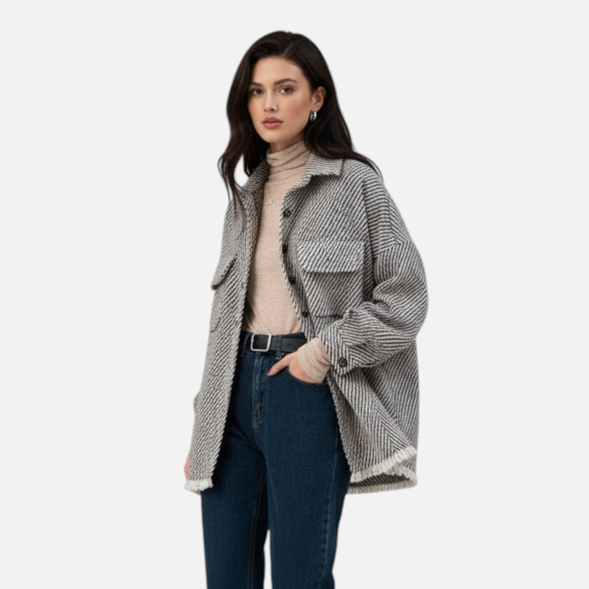 Woman wearing a patterned coat on a white background